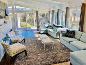 a living room with a couch and chairs and a table at Black Bear Suite Hot Tub Sleeps 4 affordable in Oakhurst