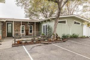 a house with a tree in a parking lot at Black Bear Suite Hot Tub Sleeps 4 affordable in Oakhurst