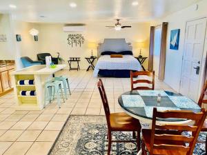 a bedroom with a bed and a table and chairs at Crane Suite Hot Tub Bbq King Bed- Sleeps 4 in Ahwahnee