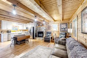 a living room with a couch and a fireplace at Buck Haven in Murphy