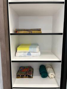 a walk in closet with towels and towels at Tambun Hillview Cottage 2 in Ipoh +34 photos