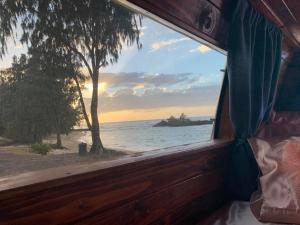 a window view of the ocean from a boat at Camper Van Hawaii in Kaneohe