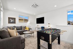 a living room with a table with a foos ball at PGA West 65 - 3 bdrm w/Loft, Sleeps 8, Pool, Gym in La Quinta