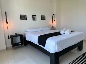 a bedroom with two beds and a television at CLUB DE GOLF in Acapulco