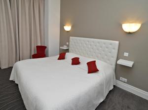 Postel nebo postele na pokoji v ubytování Hôtel Radio - Teritoria