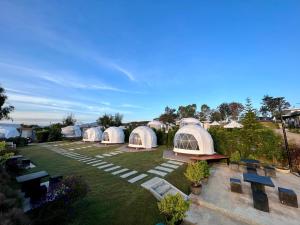 an aerial view of a group of domes in a yard at See Scape Camping Khaokho in Ban Nong Bong