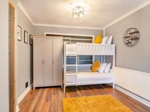 a childs bedroom with a bunk bed at Crynant Countryside Retreat in Crynant
