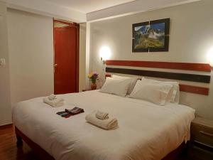 Postel nebo postele na pokoji v ubytování Raymi Inn MachuPicchu