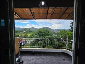 a view from the balcony of a house at Anda Betong Homestay in Ban Komo Sip Paet