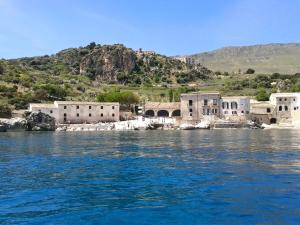 a group of buildings on the shore of a body of water at B&B Teatro in Palermo