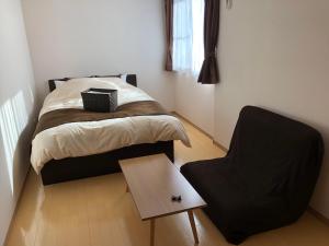 Postel nebo postele na pokoji v ubytování I・ecoⅢ（アイエコスリー）