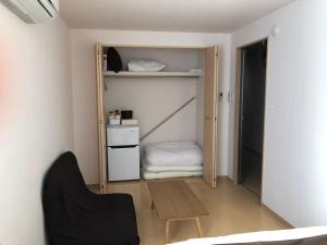 Postel nebo postele na pokoji v ubytování I・ecoⅢ（アイエコスリー）