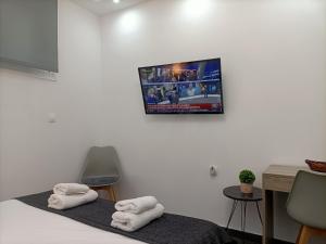 A bed or beds in a room at Central Bachelor