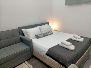 A bed or beds in a room at Central Bachelor