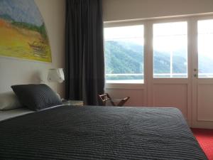 A bed or beds in a room at Hotel Nautilus