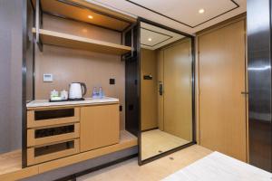 Ένα ή περισσότερα κρεβάτια σε δωμάτιο στο Orange Tree International Hotel Zhujiang New Town Huacheng Sqaure Branch - Free Shuttle Bus to Canton Fair Complex During Canton Fair Period