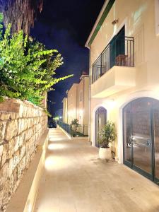 an empty street at night with a building at 49 Boutique in Zikhron Ya'akov