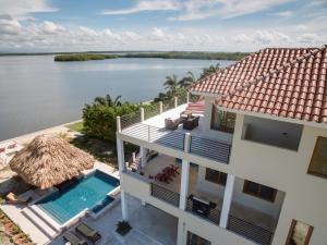 an aerial view of a house with a swimming pool at Laguna Gecko Villa in Placencia Village