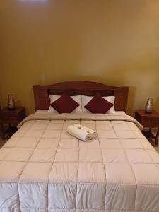 Postel nebo postele na pokoji v ubytování Bali Asli Guest House by EPS
