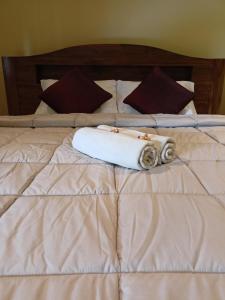 Postel nebo postele na pokoji v ubytování Bali Asli Guest House by EPS