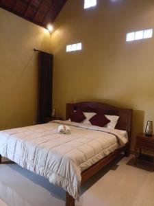 Postel nebo postele na pokoji v ubytování Bali Asli Guest House by EPS