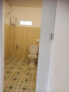 a bathroom with a toilet in a room at Bunnan Bungalows and Restaurant in Koh Rong Island