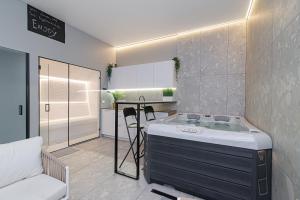 a kitchen with a bath tub in a room at Secret SPA in Vilnius