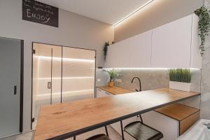 a kitchen with a table and a counter top at Secret SPA in Vilnius