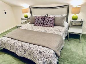 a bedroom with a large bed with two tables at Eagle Nest River Views Hot Tub Games Sleeps 6 in Ahwahnee +11 photos