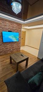 Televisyen dan/atau pusat hiburan di Apartament S24