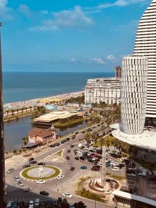 a view of a city with buildings and a street at Seaview-Studio Apartments in Orbi City in Batumi