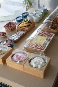 a buffet with different types of food on a counter at Akti Dimis Hotel in Tigaki
