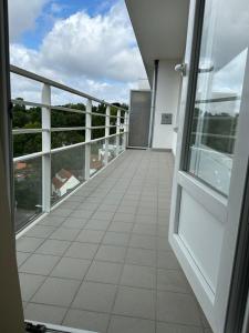 a balcony of a building with a view of the sky at Clam，grand apartment in Uccle in Brussels