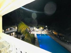 a view of a swimming pool at night at New Park Resort in Mahajanga