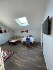 a living room with a couch and a table at Apartment 6 confort&modern in Arad