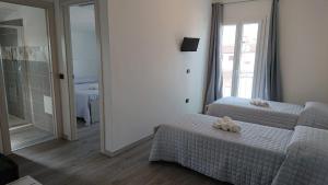 Posteľ alebo postele v izbe v ubytovaní Hotel Ogliastra