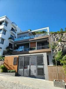 an apartment building with a gate in front of it at RUBY 2 LUXURY VILLA by NEST GROUP in Nha Trang