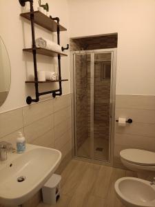 a bathroom with a shower and a sink and a toilet at Casa del Fiordaliso in San Benedetto del Tronto +29 photos