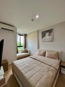 Una cama o camas en una habitación de Lagoon Bang Tao Apartment