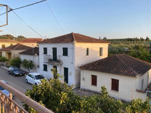 a view from the balcony of a house at Kikkos Village House in Néa Koróni