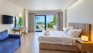 A bed or beds in a room at Ionian Theoxenia