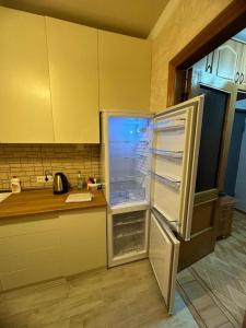 Kuchyň nebo kuchyňský kout v ubytování Apartment George