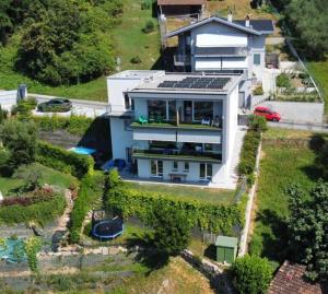 an aerial view of a house with a yard at Il Cubo di Anja Home of amazing view in Pisogne +11 photos