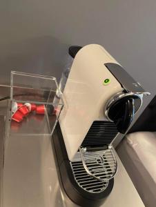 a toaster sitting on top of a table at Studio Apartment with Ocean View in Reykjavík