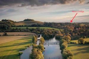 an aerial view of a river with a bridge at Oxfordshire Country Cottage in Wallingford