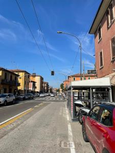 a car parked at a gas station on a city street at Nuova Casa di Mattia Bologna in Bologna