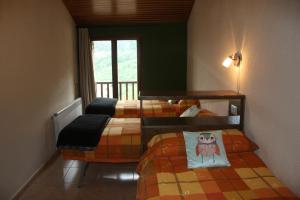 Ένα ή περισσότερα κρεβάτια σε δωμάτιο στο Cal Rosetó