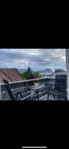 a view of a balcony with a table and chairs at Leilighet med sydvendt balkong in Ålesund
