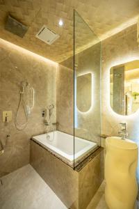a bathroom with a shower and a toilet and a sink at Ritz Residence @ Imago Loft B 7th Floor in Kota Kinabalu