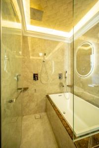 a bathroom with a glass shower and a sink at Ritz Residence @ Imago Loft B 7th Floor in Kota Kinabalu